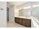Contemporary bathroom with double sinks, modern fixtures, and a bright, spacious layout for comfortable living at 10569 Sw 98Th Pl, Ocala, FL 34481