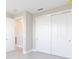 Bedroom with closets, neutral walls, and carpeted floors for a peaceful and relaxing retreat at 10569 Sw 98Th Pl, Ocala, FL 34481