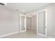 Bright bedroom features neutral walls and glass French doors, offering a versatile space with ample natural light at 10569 Sw 98Th Pl, Ocala, FL 34481