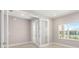 Light-filled entryway boasts tile floors and a glass-paneled front door offering a bright and welcoming entrance at 10569 Sw 98Th Pl, Ocala, FL 34481