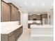 Modern kitchen featuring a large island, ample cabinet space, stainless steel appliances, and contemporary design at 10569 Sw 98Th Pl, Ocala, FL 34481