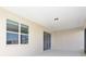Covered lanai with ceiling and sliding doors is perfect for enjoying the outdoors in comfort and style at 10569 Sw 98Th Pl, Ocala, FL 34481