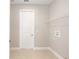 Clean laundry room with a modern shelf and tile floors provides a functional space for laundry tasks at 10569 Sw 98Th Pl, Ocala, FL 34481