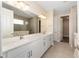 Large bathroom with double sink vanity, tile floors, and walk-in shower at 10976 Sw 101St Loop, Ocala, FL 34481