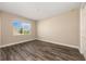 Spacious bedroom featuring hardwood floors and a bright window at 10976 Sw 101St Loop, Ocala, FL 34481