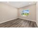 Bedroom featuring hardwood floors, a window, and recessed lighting at 10976 Sw 101St Loop, Ocala, FL 34481