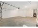 This garage features an automatic door, water heater, and windows for natural light at 10976 Sw 101St Loop, Ocala, FL 34481