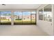 This screened in patio features large windows and beautiful views at 10976 Sw 101St Loop, Ocala, FL 34481
