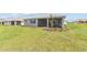 This home features a screened-in lanai and a spacious backyard with a fresh landscaping design at 10977 Sw 101St Loop, Ocala, FL 34481