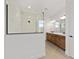Modern bathroom featuring an elegant glass shower and double vanity at 10977 Sw 101St Loop, Ocala, FL 34481