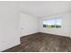 Bright bedroom with view from a large window and hard surface flooring at 10977 Sw 101St Loop, Ocala, FL 34481
