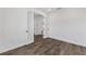 Bright bedroom with dark hardwood flooring and glass door at 10977 Sw 101St Loop, Ocala, FL 34481
