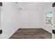 Bright bedroom with dark hardwood flooring and window view at 10977 Sw 101St Loop, Ocala, FL 34481