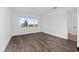 Sunlit bedroom with sleek flooring and large window offers great views at 10977 Sw 101St Loop, Ocala, FL 34481