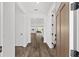 Inviting foyer with wood-look floors leading to the open-concept living area at 10977 Sw 101St Loop, Ocala, FL 34481