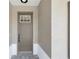Close-up of the front door, showcasing its design and hardware at 10977 Sw 101St Loop, Ocala, FL 34481