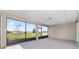 Covered screened in patio with a scenic backyard view at 10977 Sw 101St Loop, Ocala, FL 34481