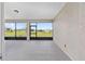 Covered screened in patio with a scenic backyard view at 10977 Sw 101St Loop, Ocala, FL 34481
