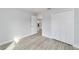 Bedroom featuring neutral paint, base molding, new flooring, and closet at 13316 Sw 105Th Pl, Dunnellon, FL 34432