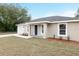 Charming single-story home featuring a well-maintained lawn and attached one car garage at 13316 Sw 105Th Pl, Dunnellon, FL 34432