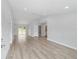 Bright living room features neutral paint, modern recessed lighting and wood-look flooring at 13316 Sw 105Th Pl, Dunnellon, FL 34432