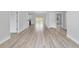 Bright living room features neutral paint, modern recessed lighting and wood-look flooring at 13316 Sw 105Th Pl, Dunnellon, FL 34432