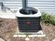 Energy-efficient Bryant central air conditioner unit with protective grille, installed outdoors at 13762 Sw 112Th Ter, Dunnellon, FL 34432