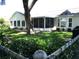 Spacious backyard featuring a screened in lanai, large shade tree, and well maintained lawn at 13762 Sw 112Th Ter, Dunnellon, FL 34432