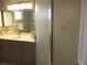 Modern bathroom with large vanity, shower stall with a frosted glass enclosure and sleek fixtures at 13762 Sw 112Th Ter, Dunnellon, FL 34432