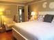 Relaxing bedroom features a neutral color scheme, comfortable bed, and access to additional rooms in the home at 13762 Sw 112Th Ter, Dunnellon, FL 34432