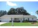 Charming single-story home boasts a well-manicured lawn and welcoming front porch at 13762 Sw 112Th Ter, Dunnellon, FL 34432