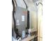 Efficient Bryant HVAC unit for home comfort and climate control, positioned near a fridge at 13762 Sw 112Th Ter, Dunnellon, FL 34432