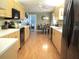 Well-maintained kitchen with wood cabinets, long countertop, and black appliances at 13762 Sw 112Th Ter, Dunnellon, FL 34432