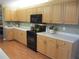 Efficient kitchen with wood cabinetry, modern appliances, and spacious countertops at 13762 Sw 112Th Ter, Dunnellon, FL 34432