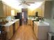 Spacious kitchen featuring wood cabinets, laminate floors, and lots of natural light at 13762 Sw 112Th Ter, Dunnellon, FL 34432