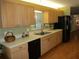 Well-lit kitchen with wooden cabinets, modern appliances, and ample counter space at 13762 Sw 112Th Ter, Dunnellon, FL 34432