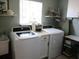 Functional laundry area featuring new appliances, cabinets and natural light at 13762 Sw 112Th Ter, Dunnellon, FL 34432