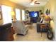 Inviting living room with neutral tones, comfortable seating, and a ceiling fan at 13762 Sw 112Th Ter, Dunnellon, FL 34432