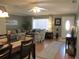 Inviting living room with cozy seating, ceiling fan, and natural light at 13762 Sw 112Th Ter, Dunnellon, FL 34432