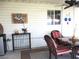 Inviting screened patio with table, chairs, ceiling fan, and exterior window at 13762 Sw 112Th Ter, Dunnellon, FL 34432