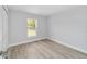 Bright bedroom with modern flooring, fresh paint and natural light at 13793 Sw 100 Ln, Dunnellon, FL 34432