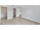 Bright bedroom features modern flooring, fresh paint, and ensuite bathroom and closet at 13793 Sw 100 Ln, Dunnellon, FL 34432