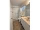Updated bathroom features walk-in shower with grab bar and neutral color palette at 2209 Ne 40Th Ave, Ocala, FL 34470