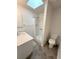 Bright bathroom features walk-in shower and neutral color palette at 2209 Ne 40Th Ave, Ocala, FL 34470