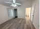 The main bedroom features luxury vinyl floors, ceiling fan and private bathroom at 2209 Ne 40Th Ave, Ocala, FL 34470