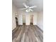 Bright bedroom boasts vaulted ceilings, updated floors, and ceiling fan at 2209 Ne 40Th Ave, Ocala, FL 34470