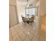 Cozy breakfast nook with a glass table, seating, and natural light at 2209 Ne 40Th Ave, Ocala, FL 34470