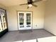 The back lanai offers a ceiling fan and easy access to the backyard at 2209 Ne 40Th Ave, Ocala, FL 34470