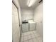 Convenient laundry room with tile flooring, washer, and dryer at 2209 Ne 40Th Ave, Ocala, FL 34470