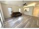 Spacious living room with modern floors and a kitchen view at 2209 Ne 40Th Ave, Ocala, FL 34470